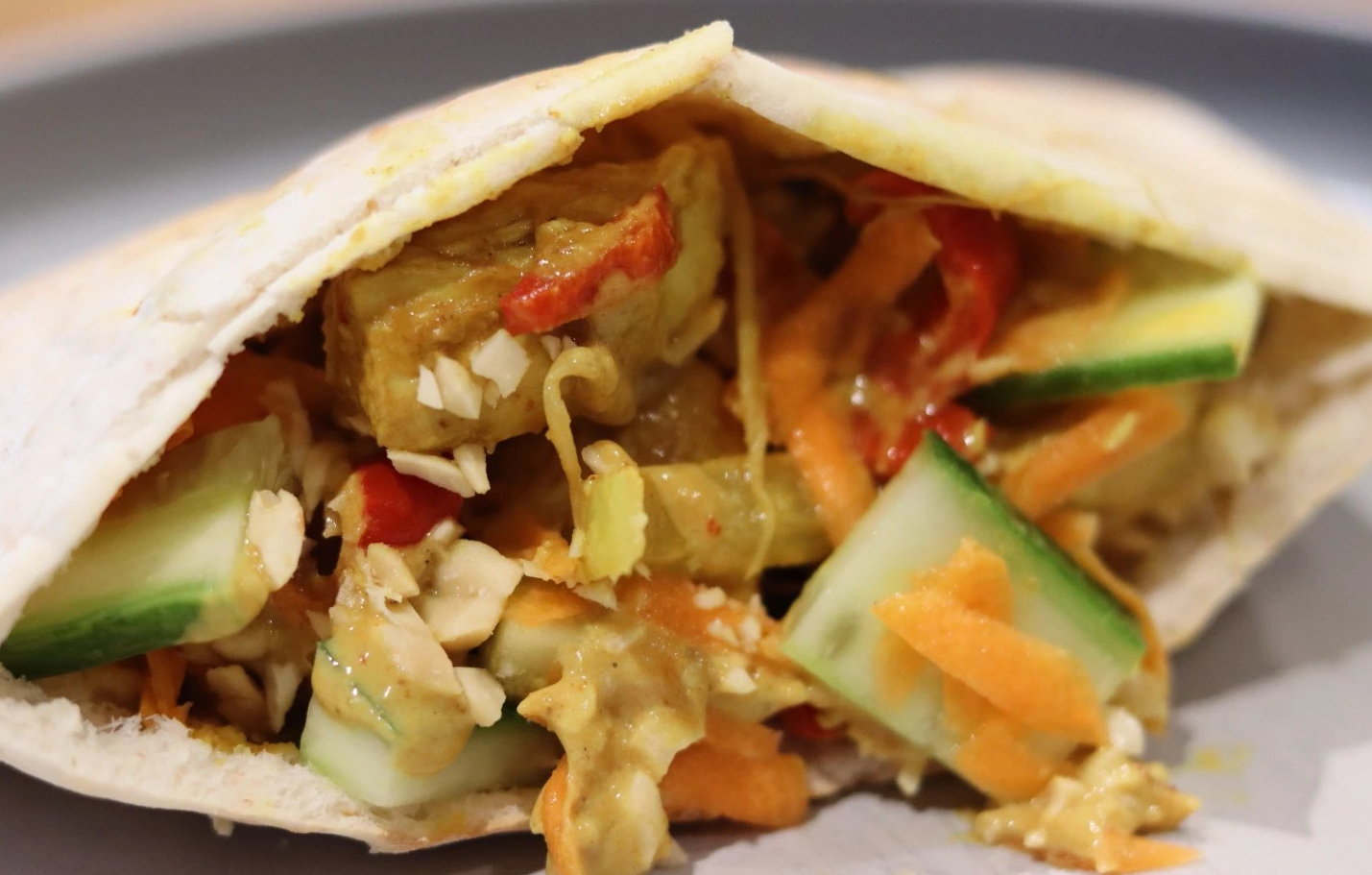 chicken satay pittas with pickled vegetables and peanuts
